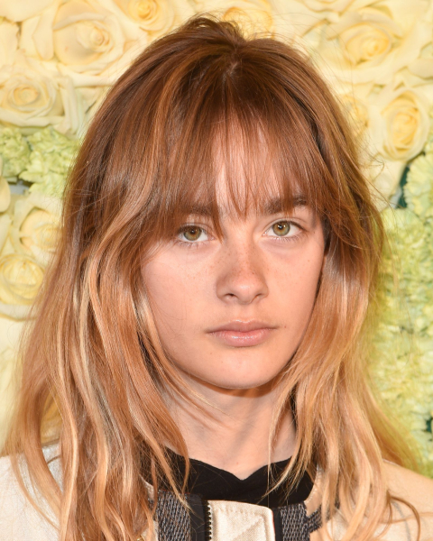 Closeup shot of Camille Jansen with copper rose hair